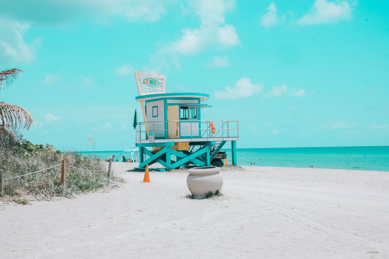 Calm Gulf water and empty white sand beach in Naples on a clear spring morning