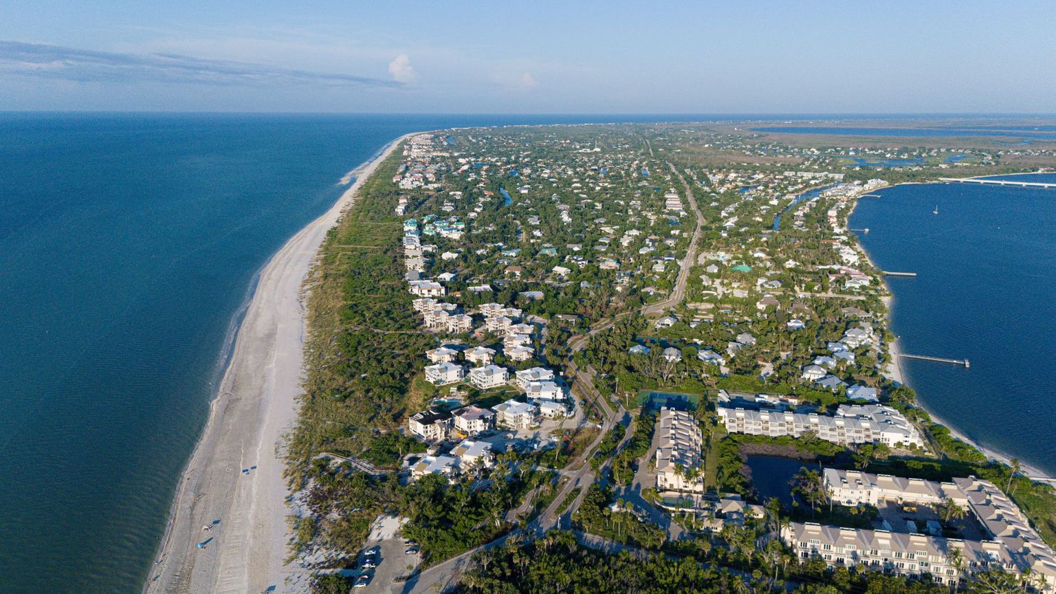 Curving beach and high-rise skyline of Marco Island seen from the Gulf